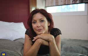 18 year old female Doris G slips off her underwear to pose naked on her bed